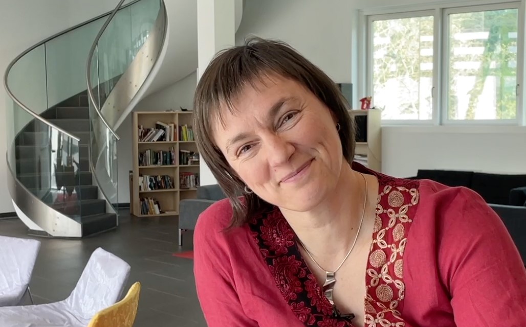 ISTA Alumna Janina Kowalski smiling in front of a staircase